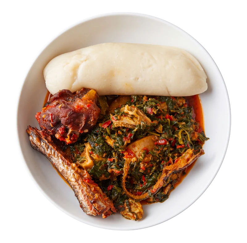 Efo riro vegetable stew with pounded yam, Nigerian food in Winnipeg
