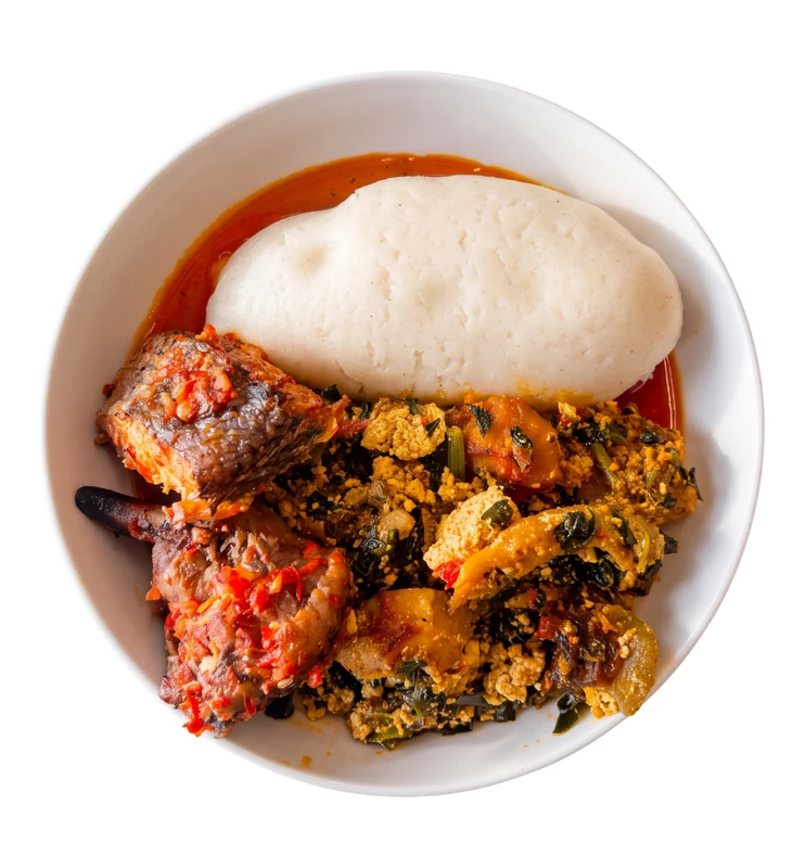 Nigerian egusi soup with semolina and pounded yam in Winnipeg